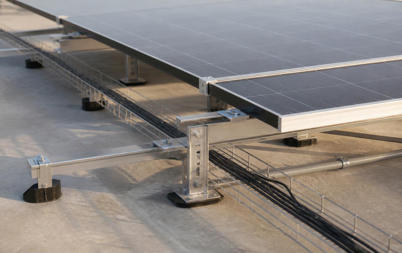 Solar mounting rails and cable containment installed on a flat concrete roof
